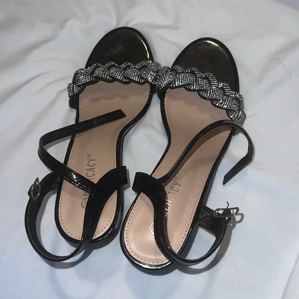 Heels . Bought these in a store . Wore only once black and silver